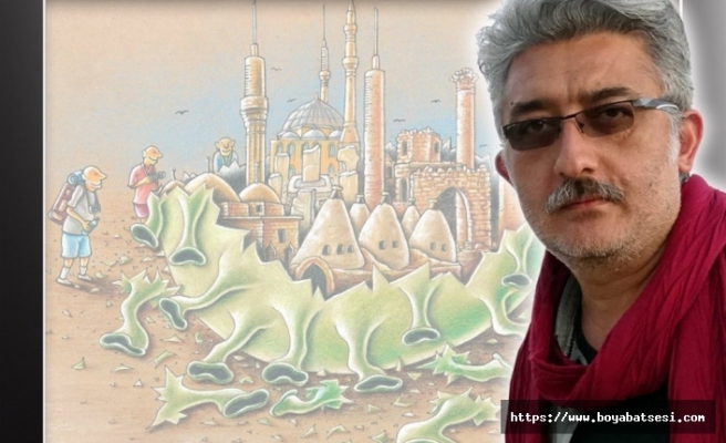 Boyabatlı Karikatürist Ayrancıoğlu kitaplarını imzalıyor